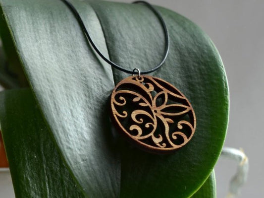 Floral Circle Pendant in cherry on leather cord