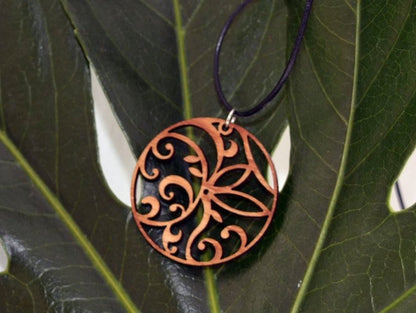 Floral Circle Pendant in cherry on leather cord